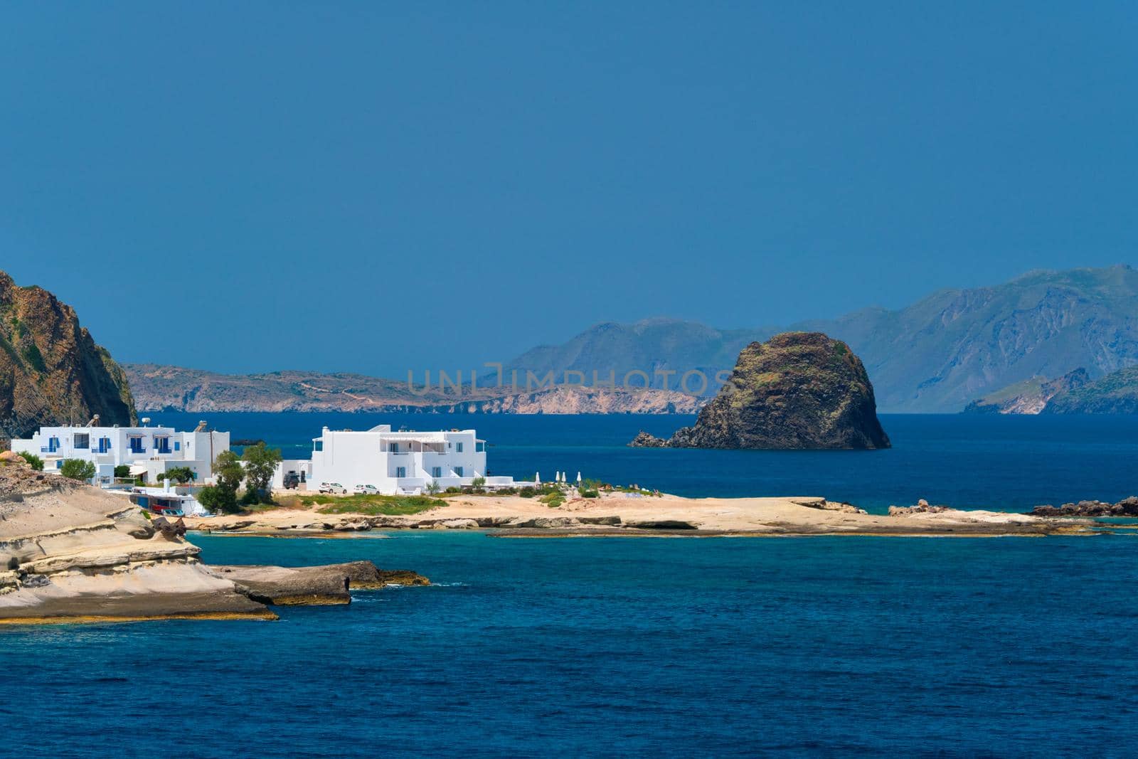 Greek fishing village with traditional whitewashed white houses on Milos island by dimol