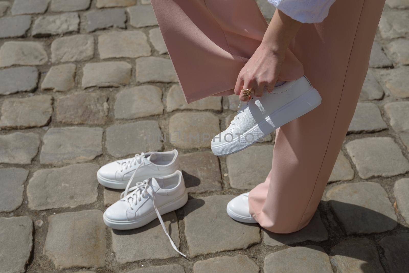 New and old white sneaker shoes . contrast, comparison, different, new and old, good and bad, clean and dirty concept. woman puts on new shoes