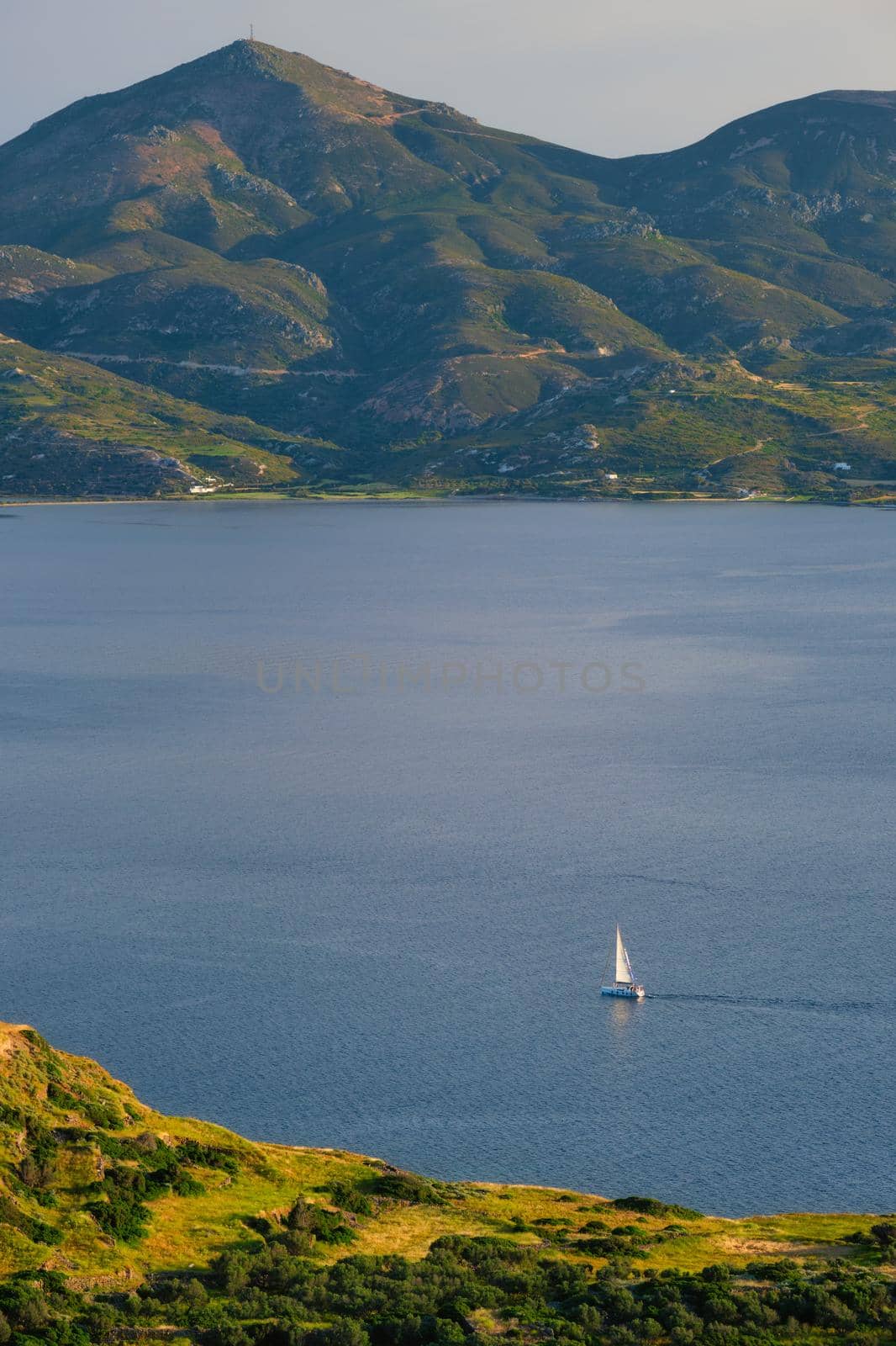 Yacht boat in Aegean sea near Milos island on sunset. Milos island, Greece