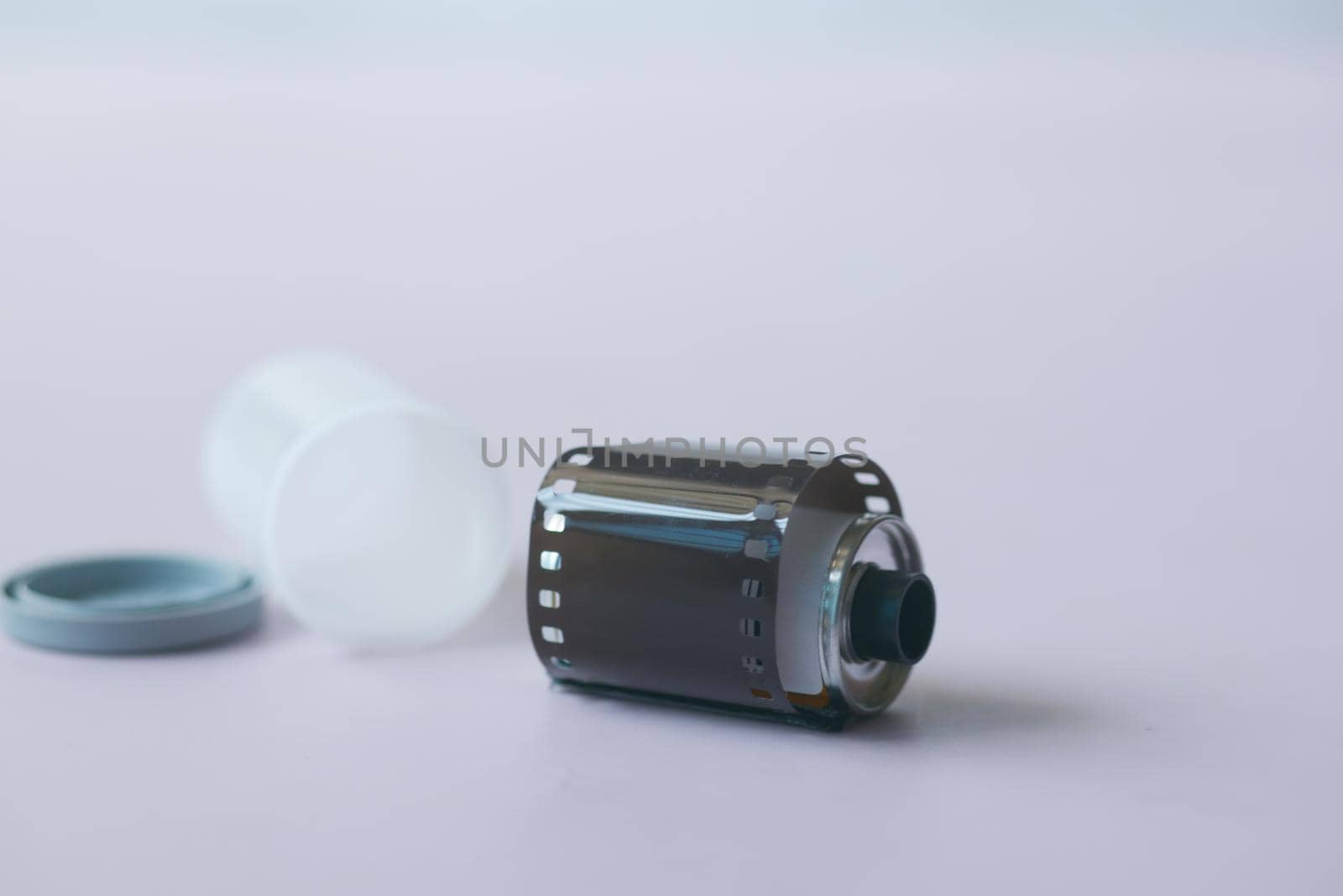 close up of camera with film rolls on table .