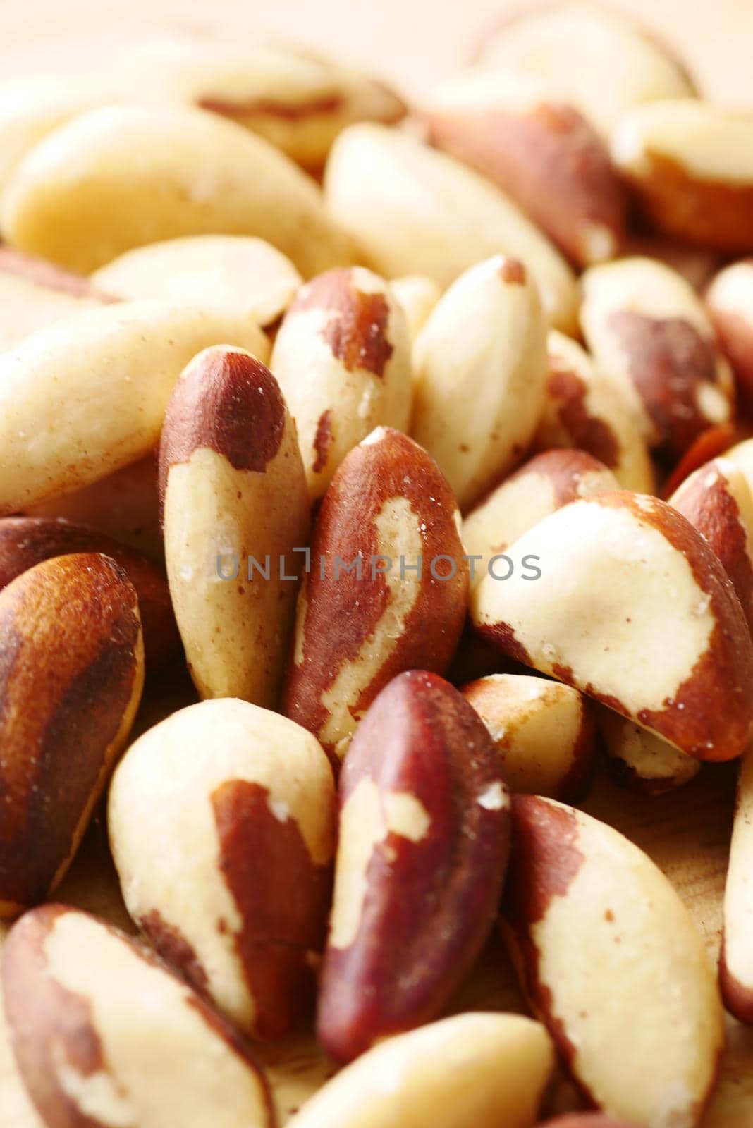 close up of Brazilian nut on wooden background .