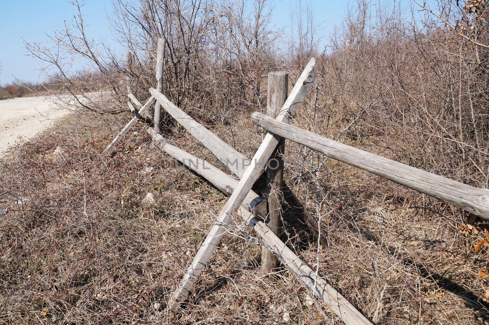 old broken wooden fence in the countryside.