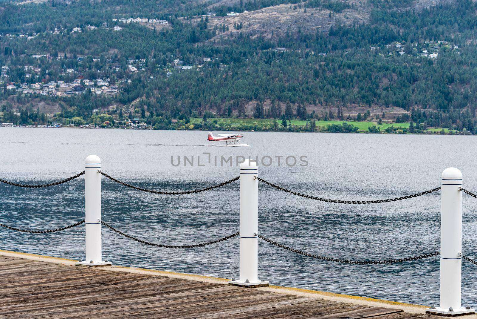 Hydro airplane preparing to take off Okanagan lake surface.