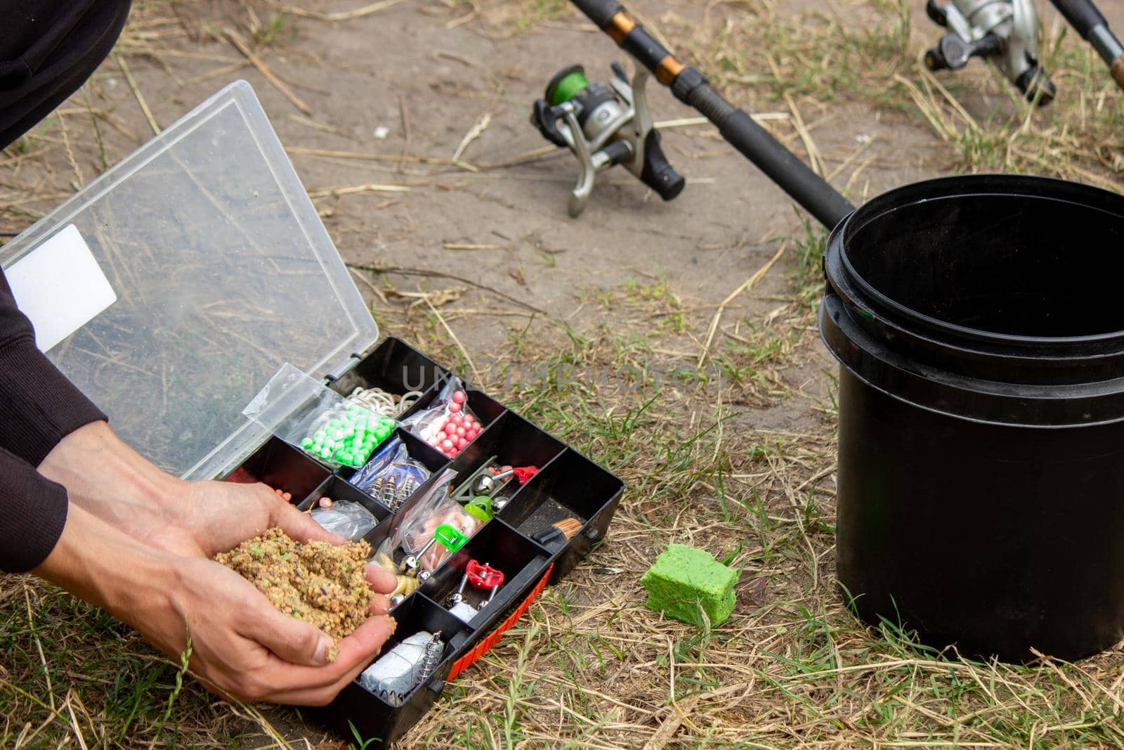 fishing tackle on a wooden float with mountain background and selective focus, nature