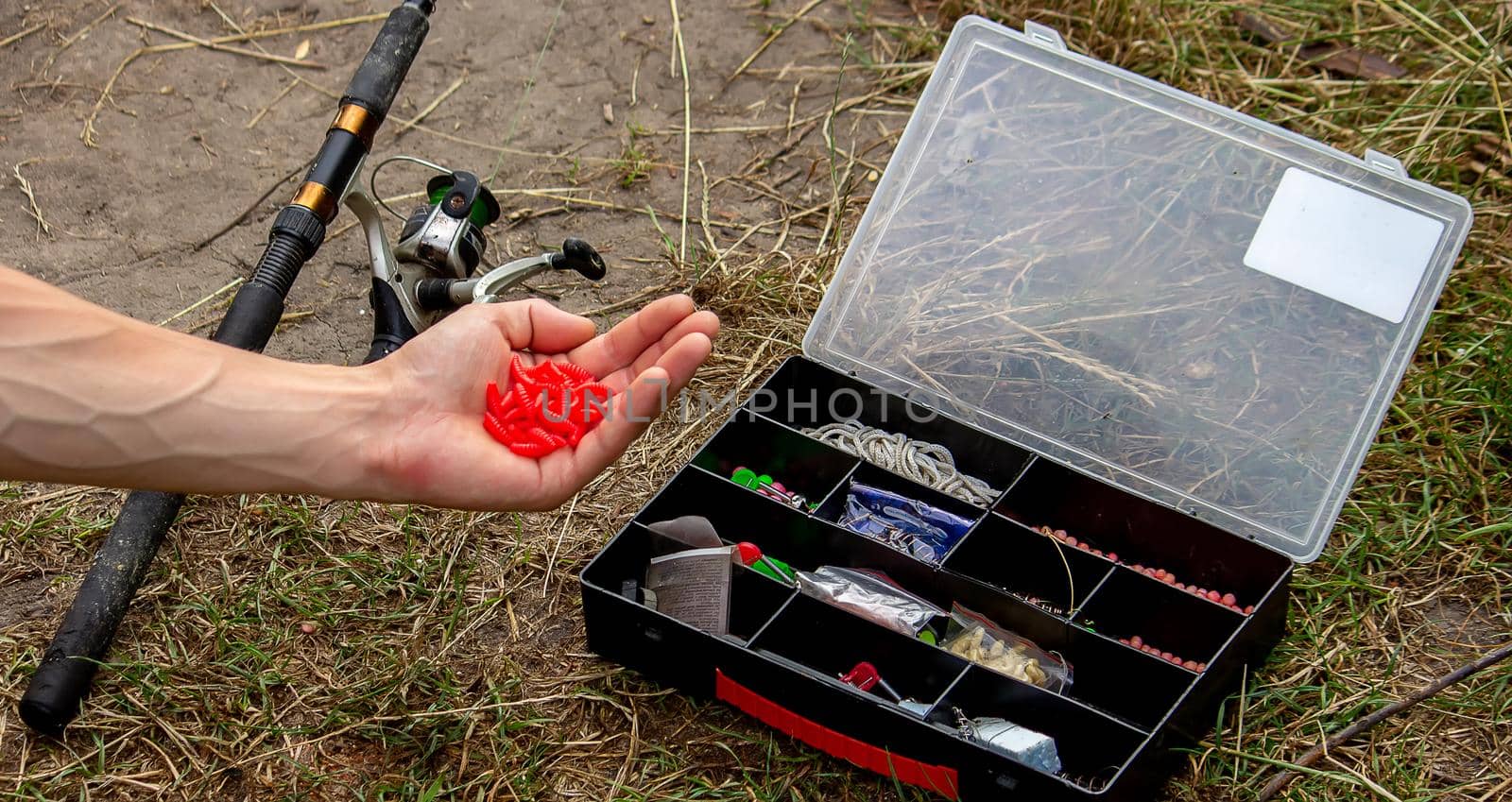 fishing tackle on a wooden float with mountain background and selective focus, nature