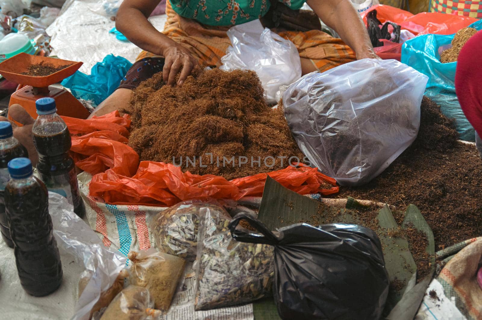 High angle view of a market vendor selling dried tobacco fibers in Bukit Lawang North Sumatra, Indonesia