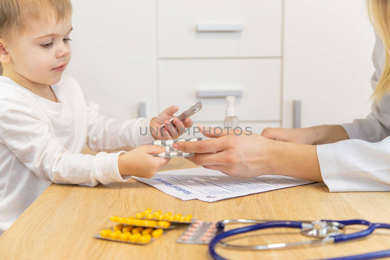 child being checked by a doctor. Selective focus