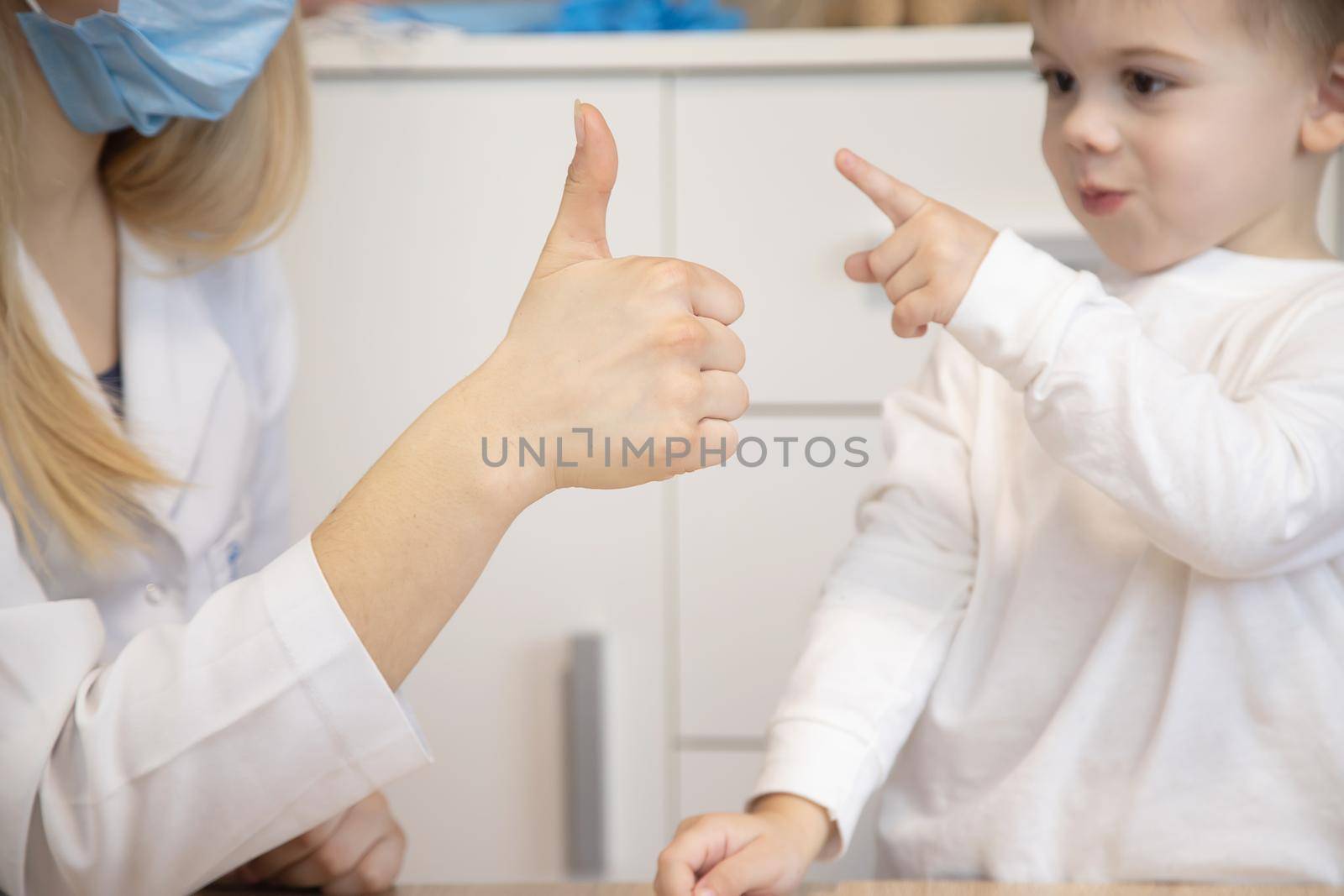 child being checked by a doctor. Selective focus