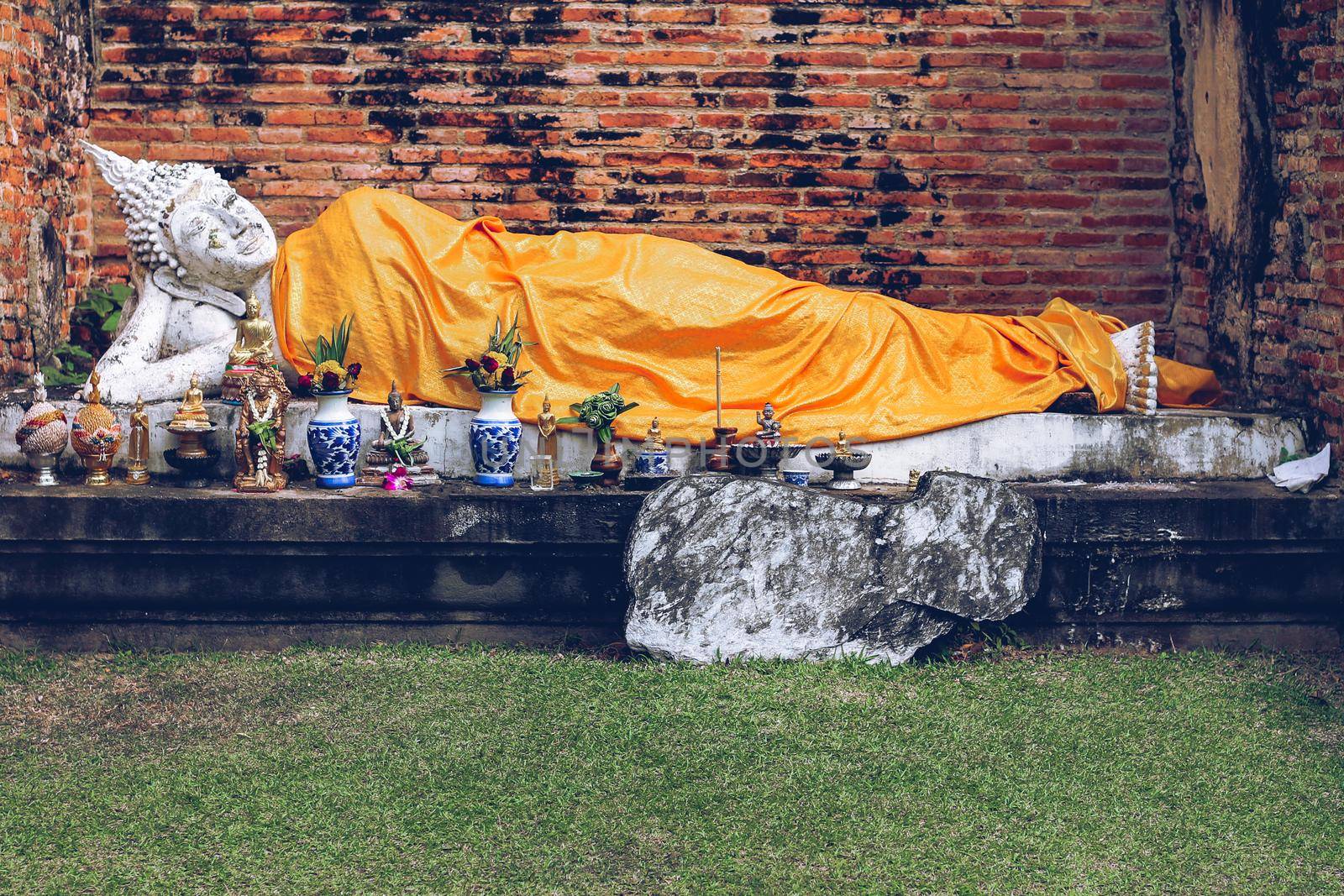 Reclining Buddha statue in Wat Yai Chai Mongkhol inside Ayutthaya Historical Park in Thailand