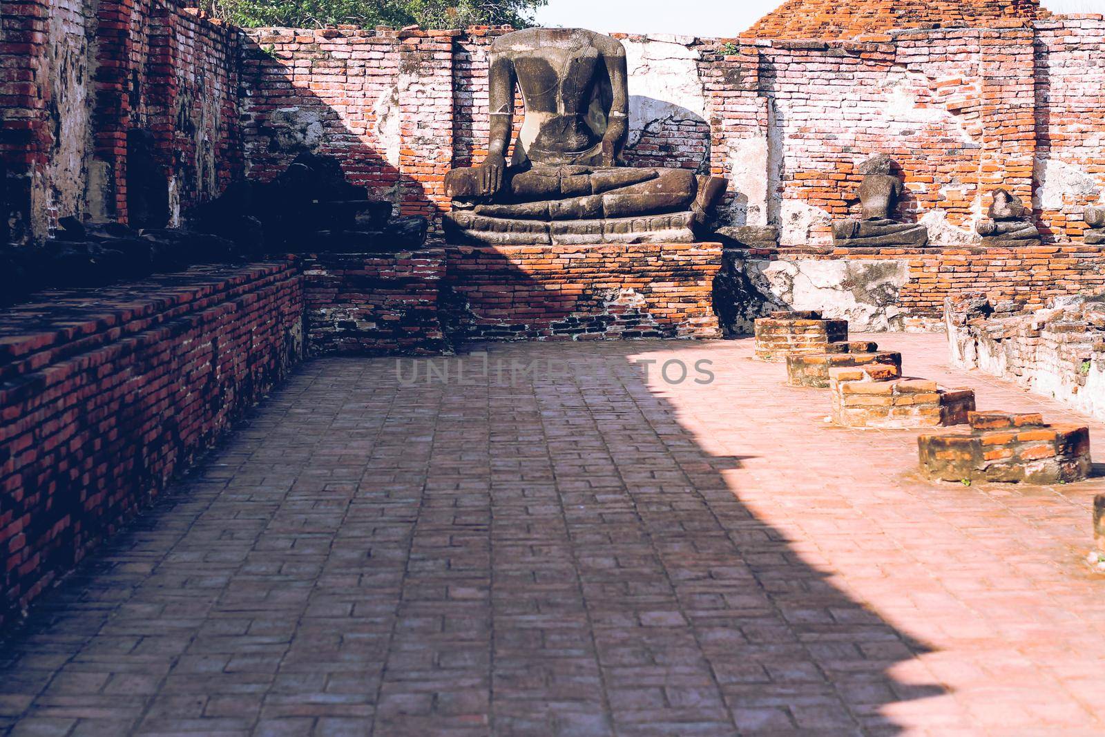 Remnants of the ancient ruins of Wat Chaiwatthanaram, part of the famous Ayutthaya Historical Park in Thailand