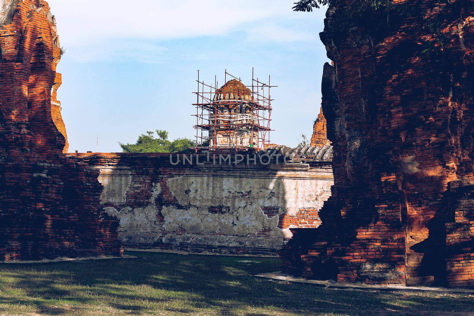Ancient temple ruins in Wat Choeng Tha, part of the famous Ayutthaya Historical Park in Thailand