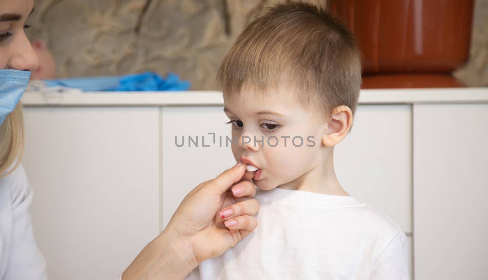 child being checked by a doctor. Selective focus