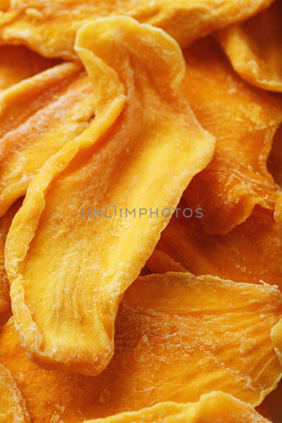 Dried sweet mango fruit slices as textural orange by AlexGrec