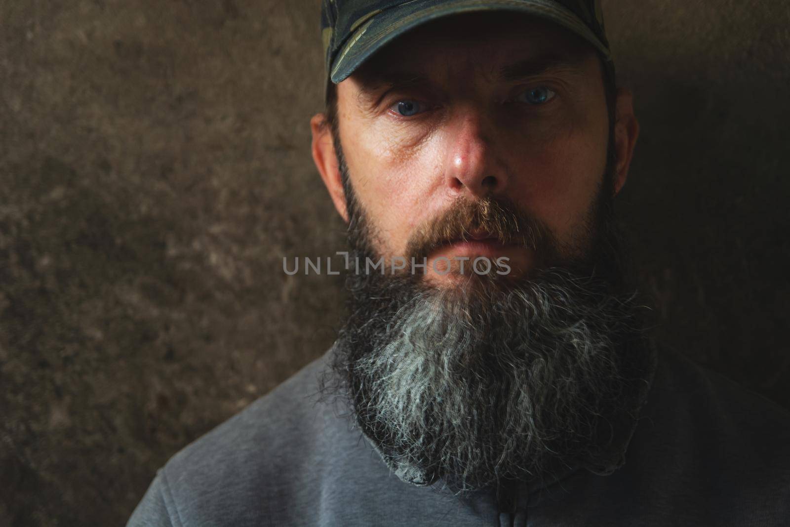 A man with a long beard in a baseball cap by darekb22