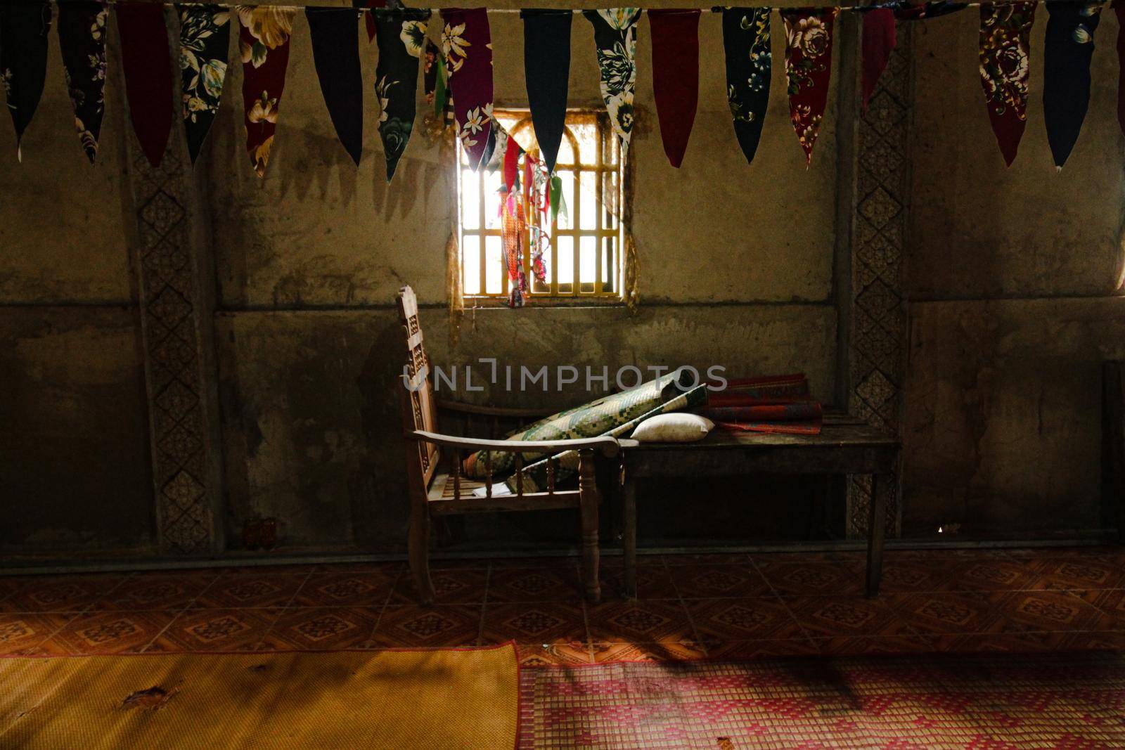 Creepy scenery of a chair inside a dark abandoned place