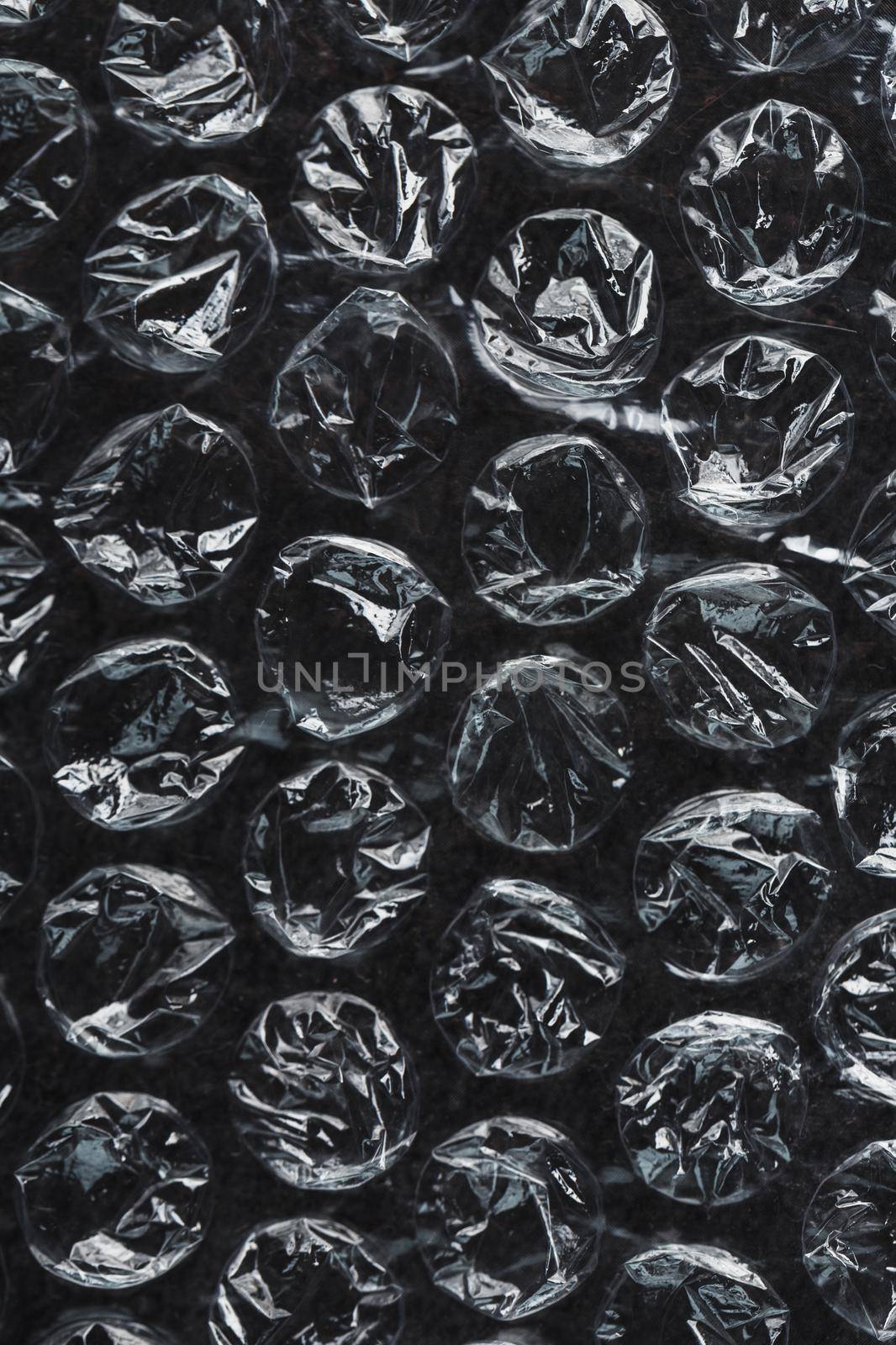 Packing bubble wrap for parcels on a Black background in full screen