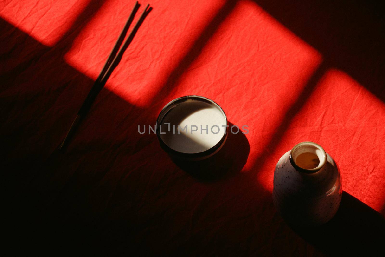 Light and shadows cast on ceramic incense holder showing the concept of mindfulness, tranquility and life balance