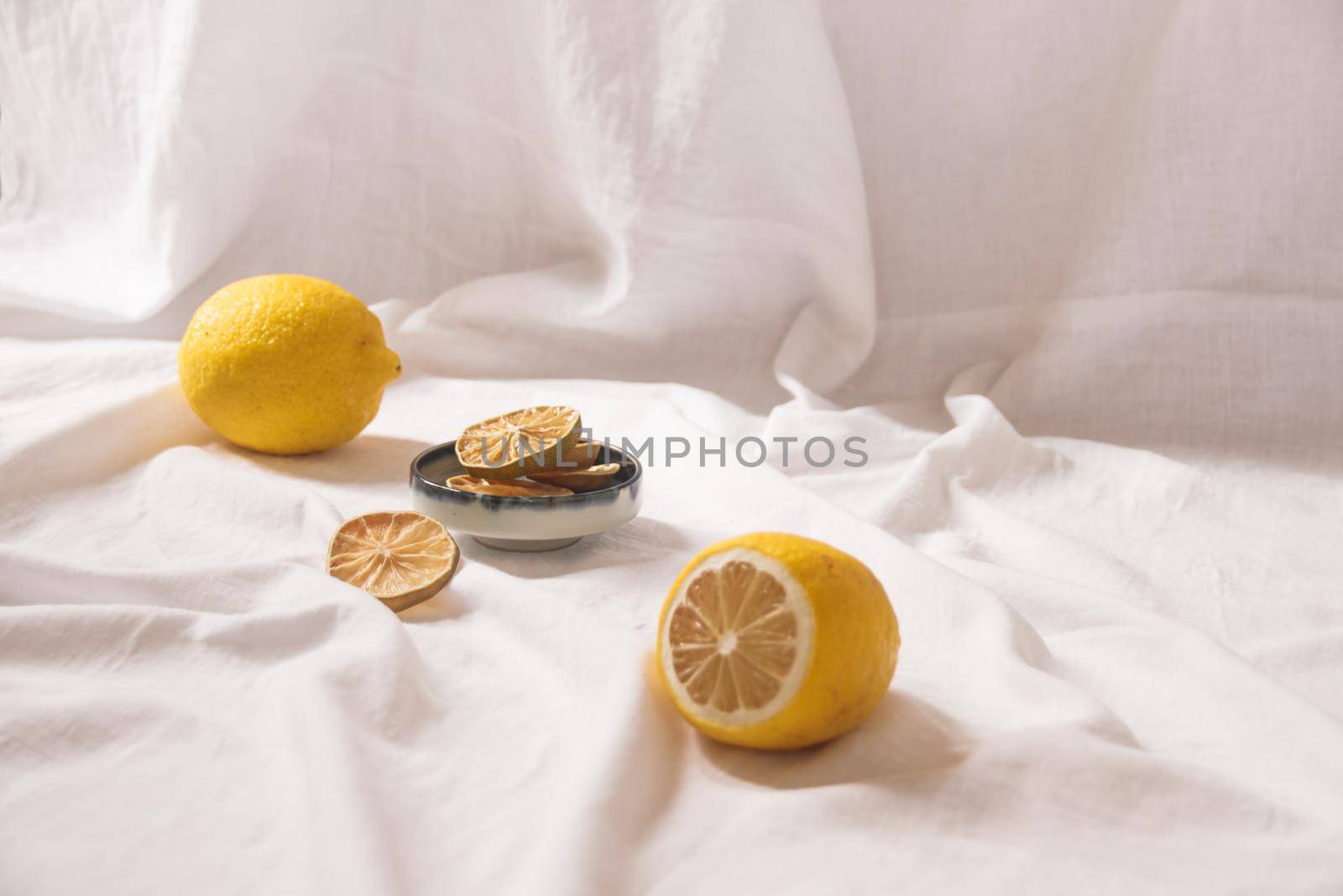 Minimalist still life of fresh and dried lemons by Sonnet15