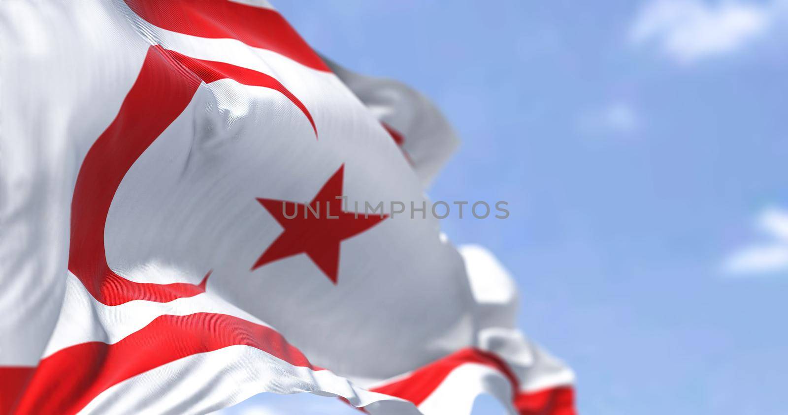 Detail of the national flag of Northern Cyprus waving in the wind on a clear day by rarrarorro