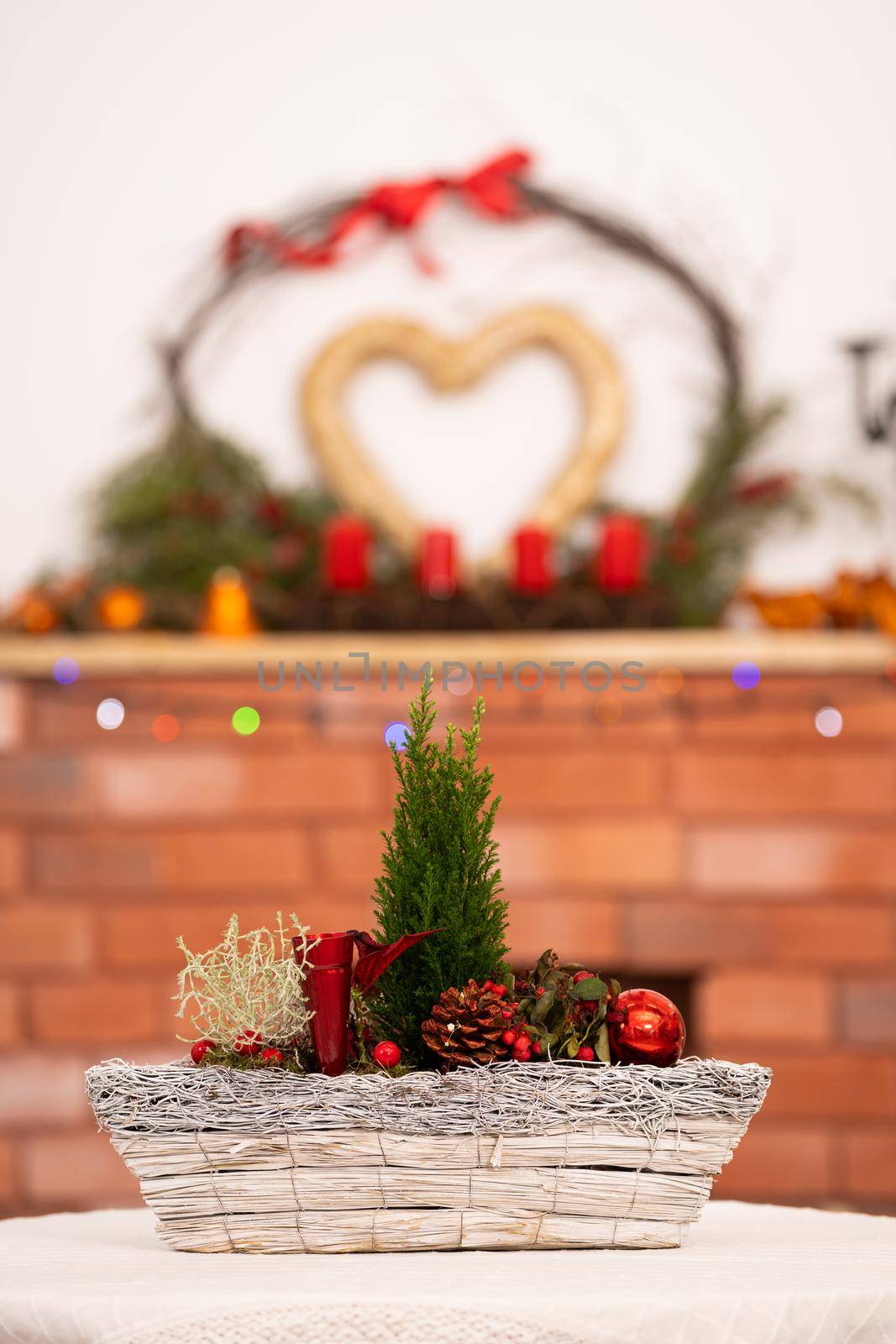 On the first one, ladies Christmas tablecloth and on the second one decorated fireplace for Christmas time