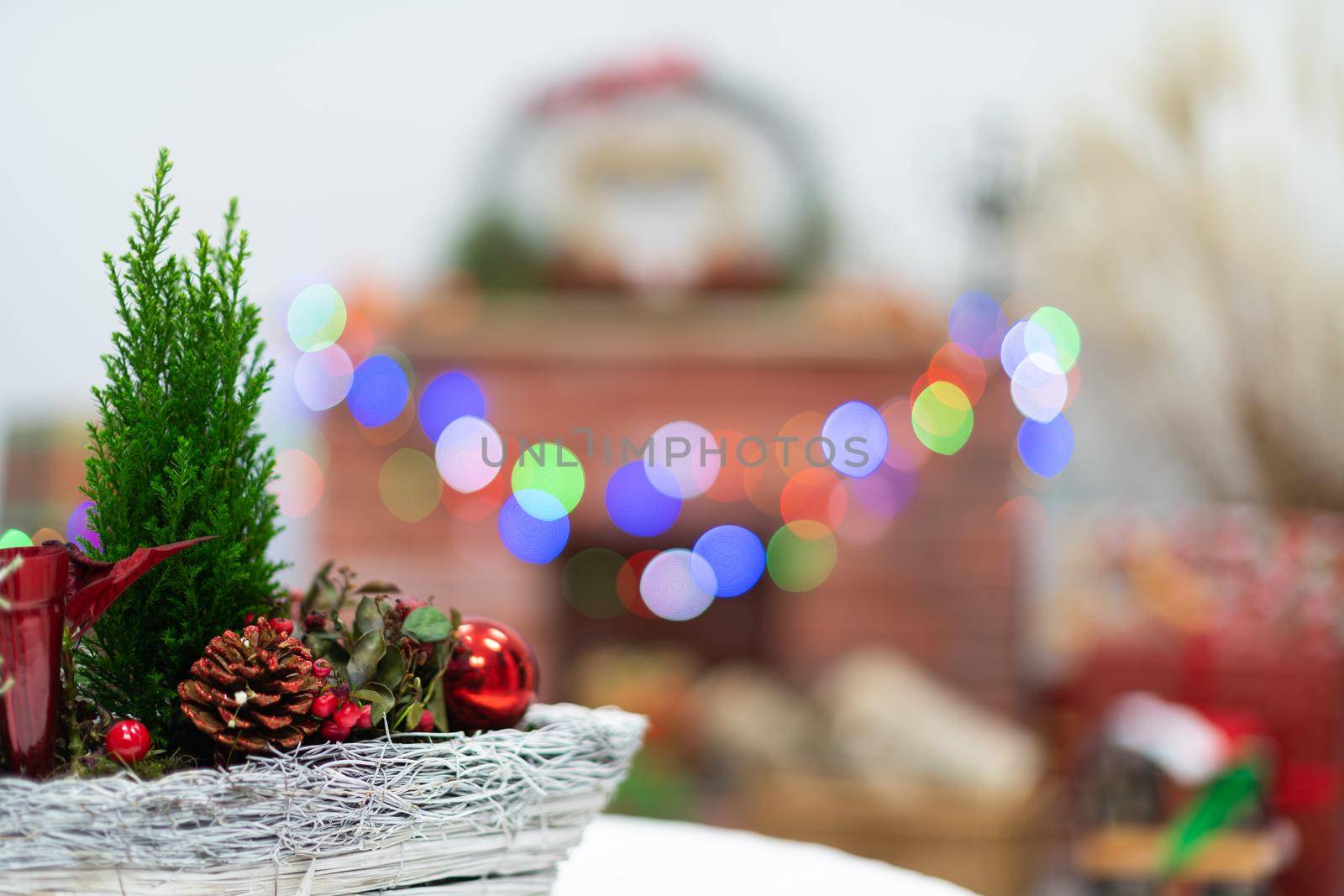 Close-up view of the Christmas reed that accompanies every Christmas. In the distance you can see the fireplace and the Christmas tree lights and the heart shape