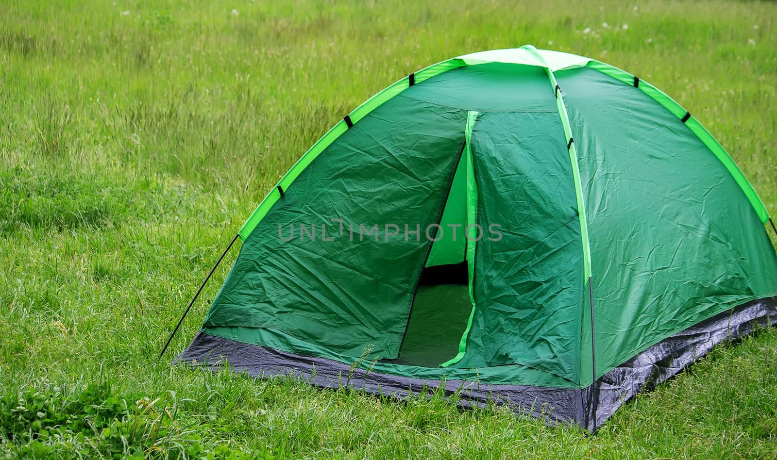 tourist tent, outdoor recreation near the river. Nature, recreation, camping Selective focus