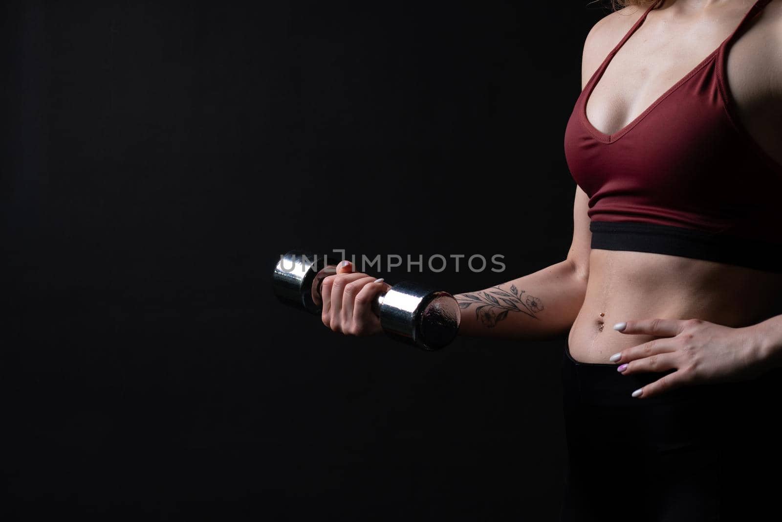 A kira her shiny in holds knightly beautiful dumbbells as hands girl dumbbells sports body, for health lifestyle in young and trainer strength, strong biceps. Care ABS bodybuilder, power