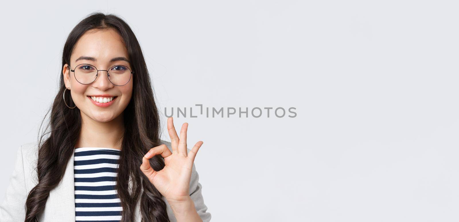 Business, finance and employment, female successful entrepreneurs concept. Close-up of professional real estate broker guarantee quality of her service, showing okay sign and smiling confident.