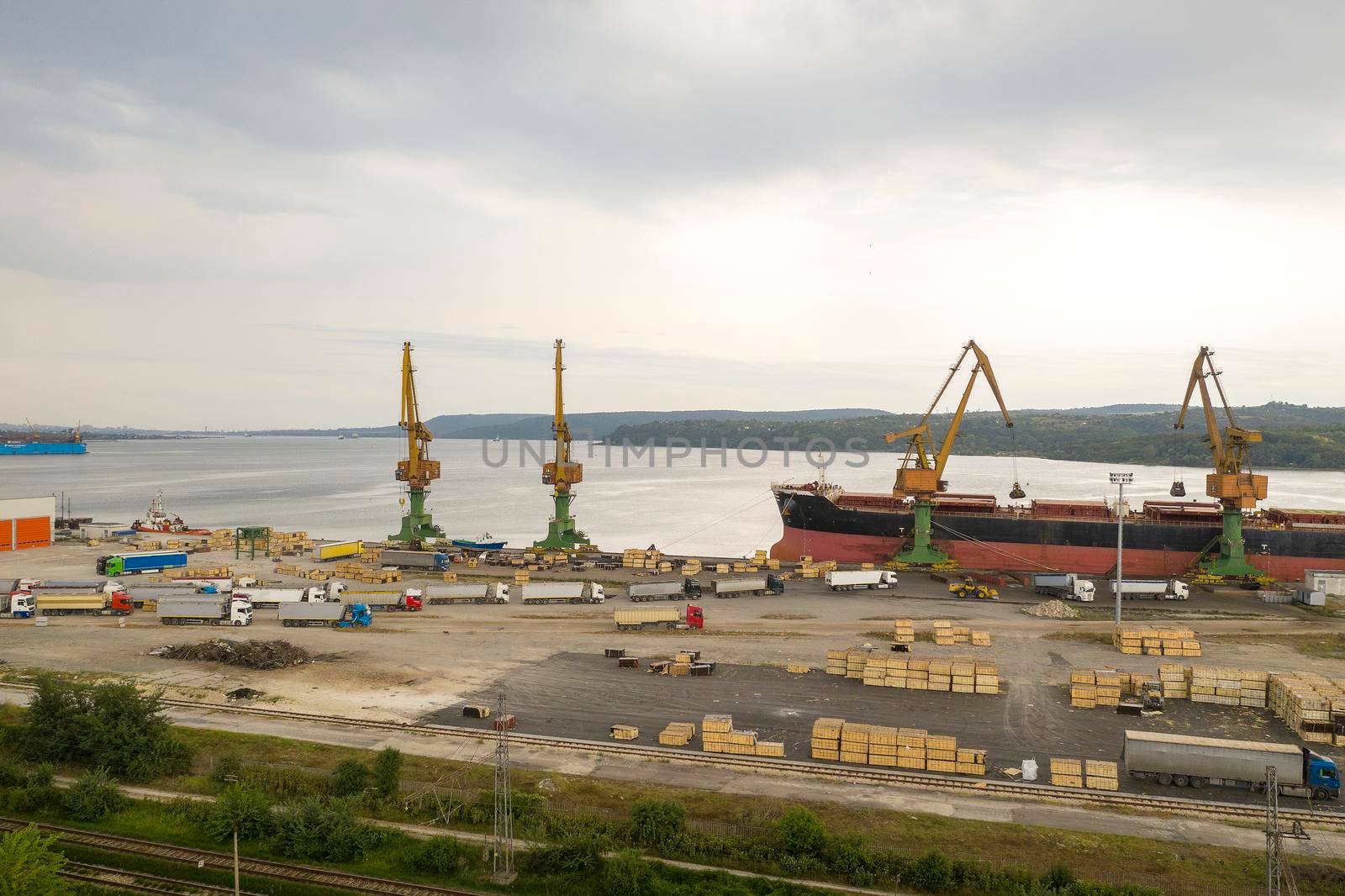 Aerial view from drone of loading the cargo ship. Work in port.