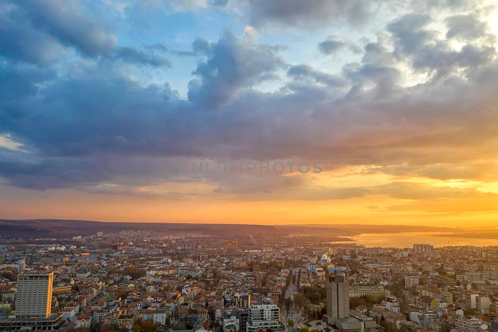 Amazing colorful clouds at sunset over the city. Varna, Bulgaria by EdVal