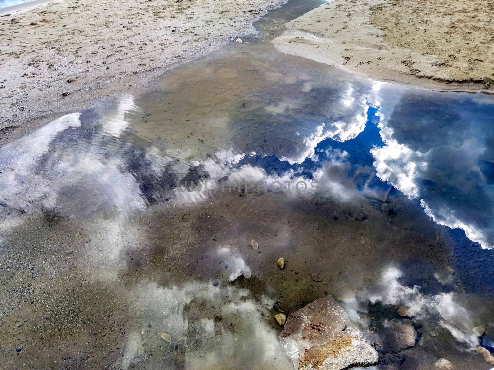 Beauty sky reflection in the water near sea sand  by EdVal