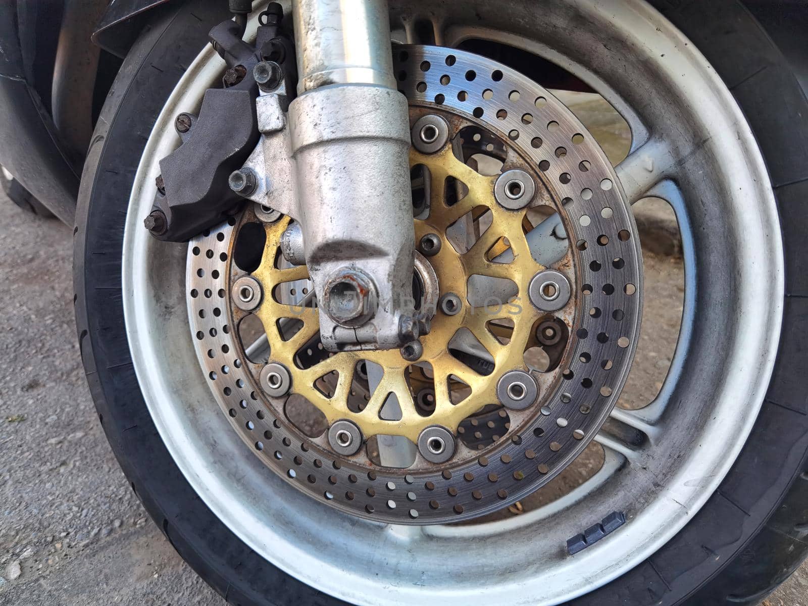 Motorcycle brake disc on a wheel close-up