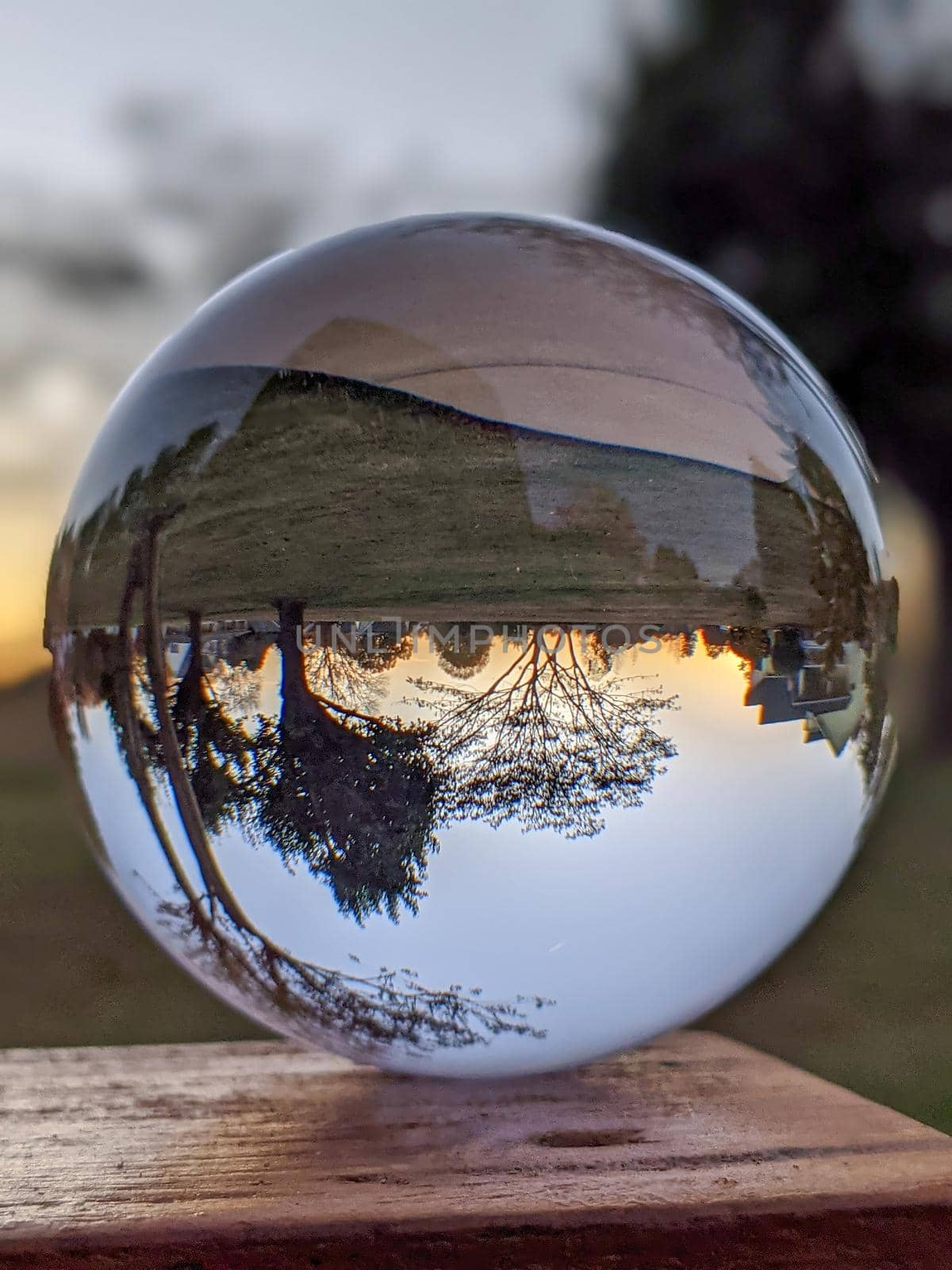 Reflections of the sunset in a cloudy day in a crystal ball  by digidreamgrafix