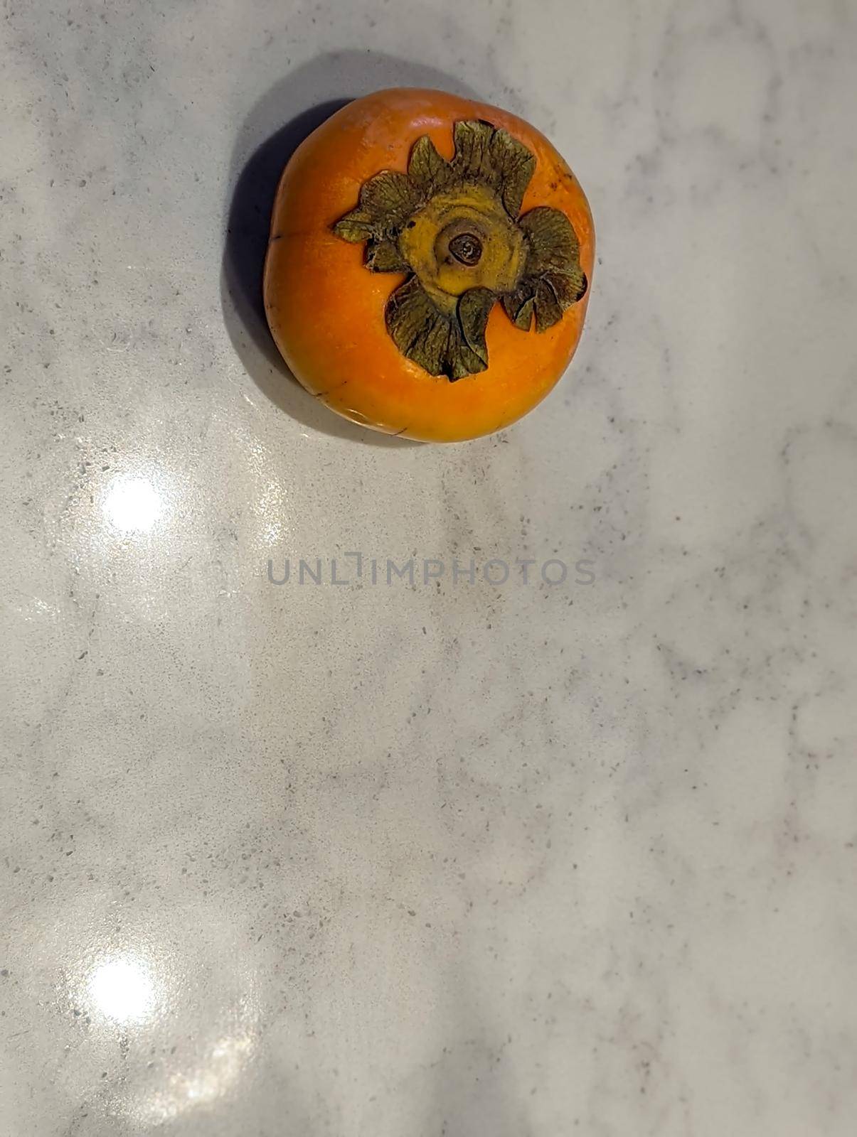 fresh persimmons on a kitchen table  by digidreamgrafix