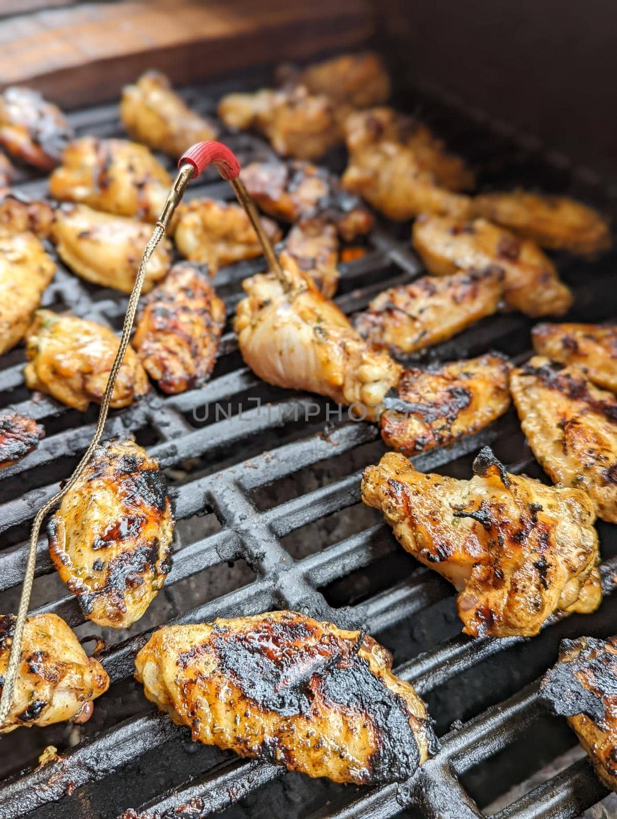 Chicken meat fried on a barbecue grill