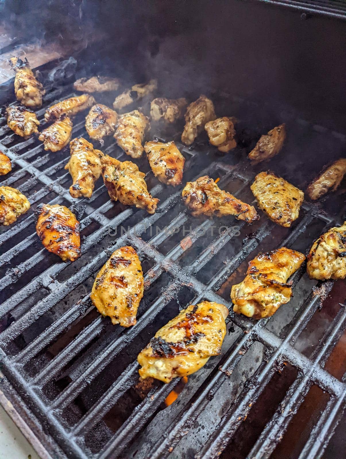 Chicken meat fried on a barbecue grill