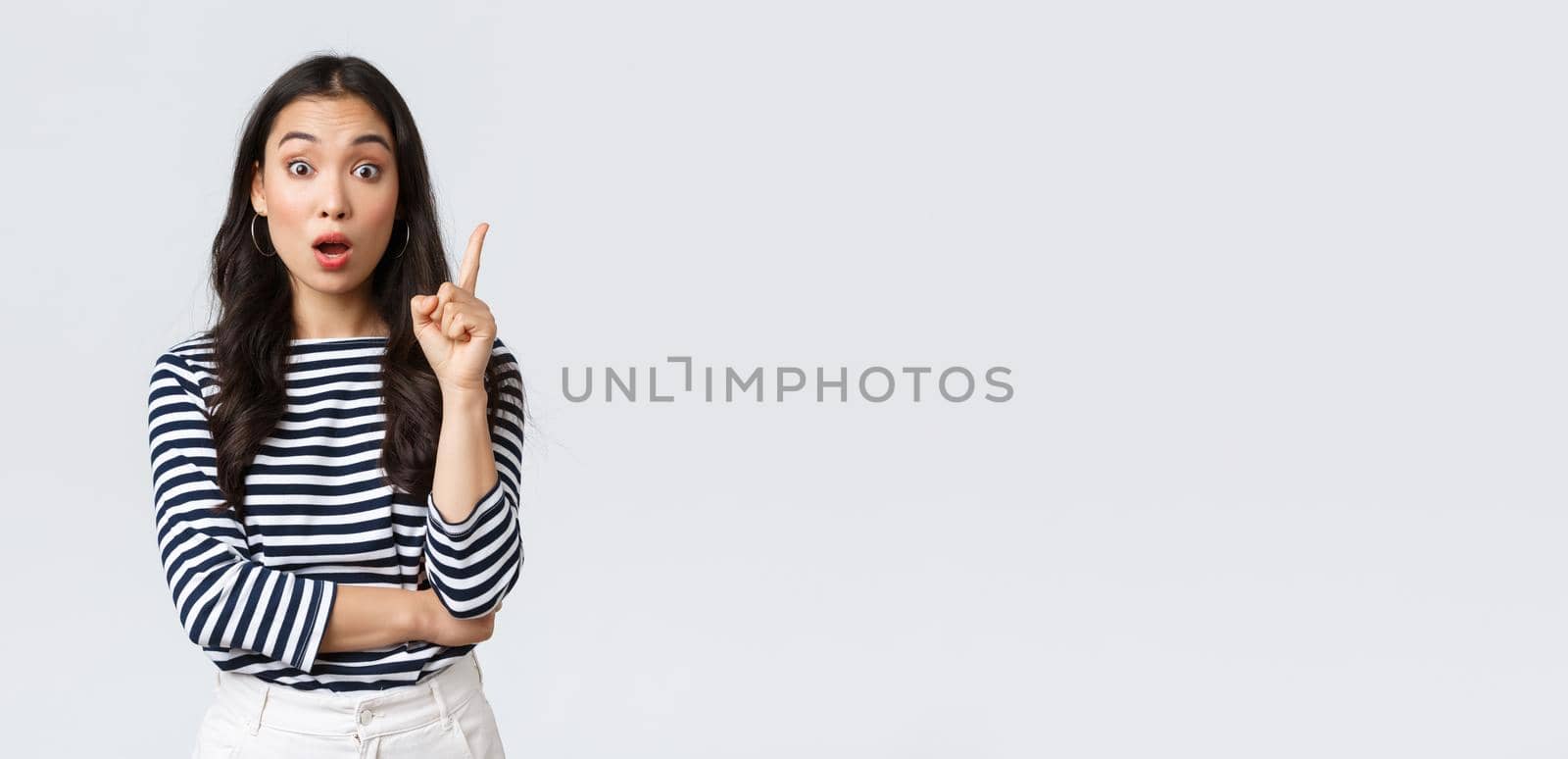 Lifestyle, people emotions and casual concept. Excited smart and creative asian female coworker have suggestion, add idea, raising index finger to say thought or plan, standing white background.