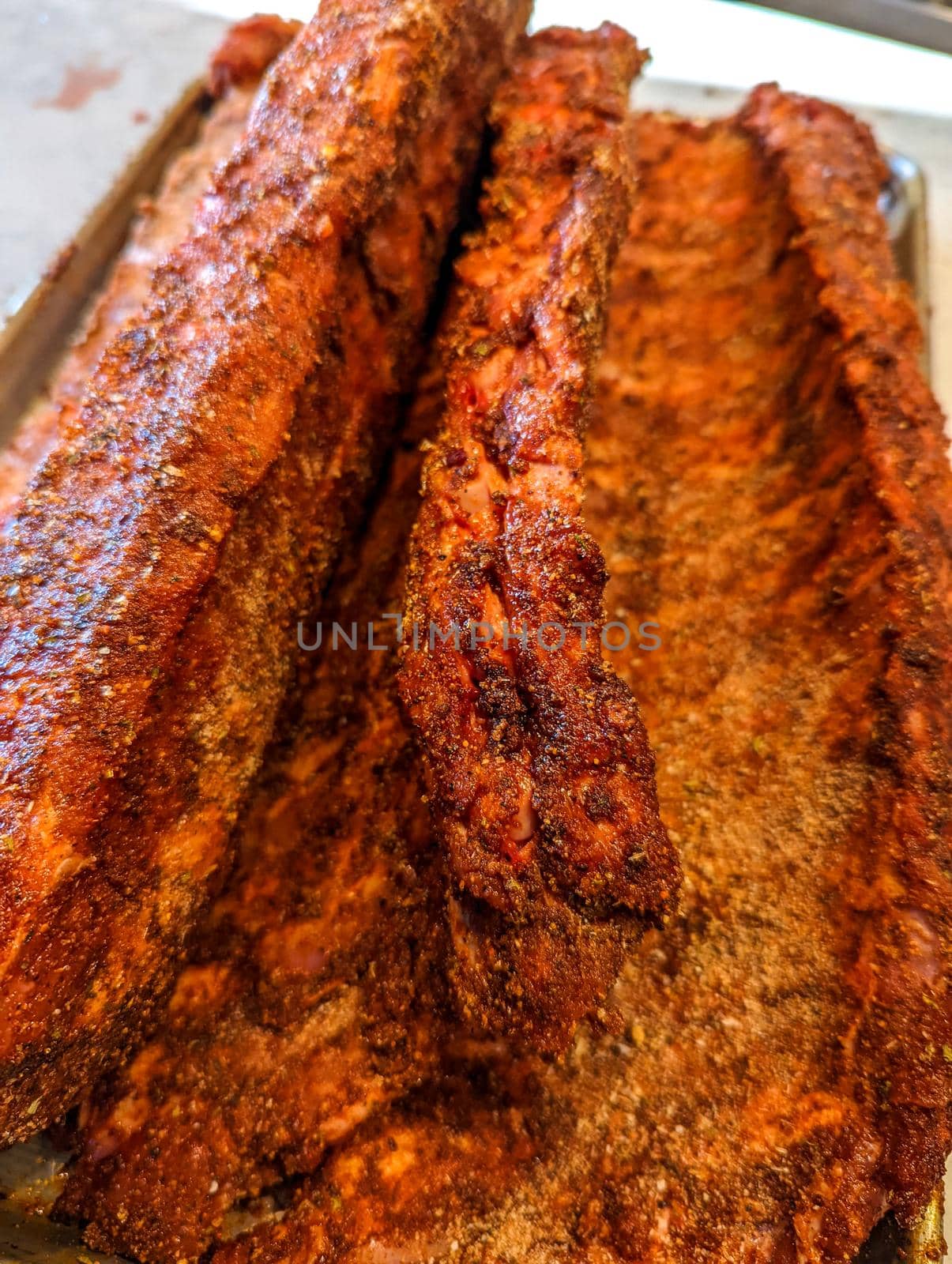 raw uncooked seasoned pork bbq ribs redy to smoke by digidreamgrafix