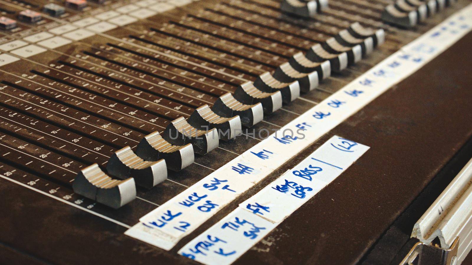 Audio mixing desk for sound channels for a live band concert at a festival