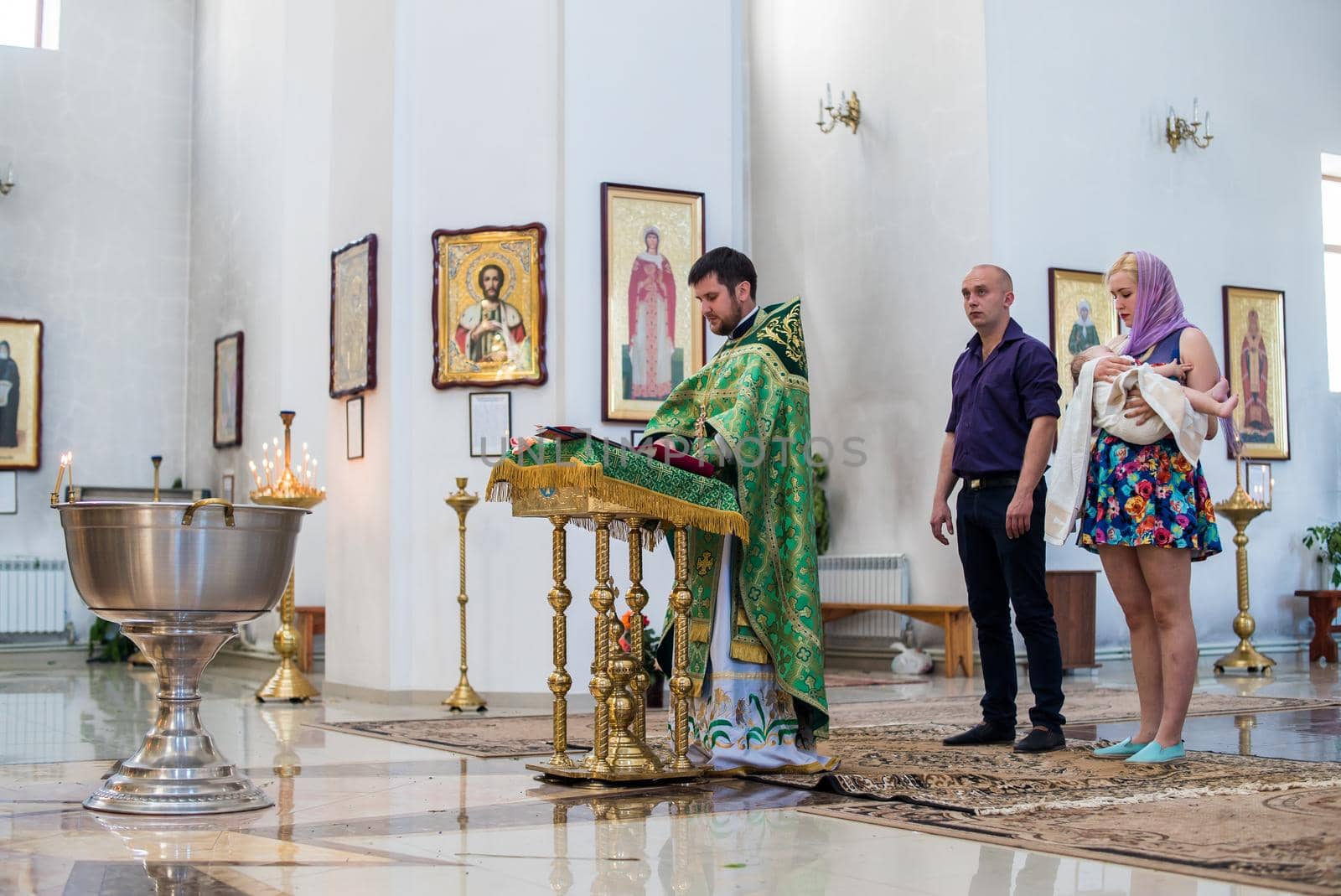 Krivoy Rog, Ulraine - 06.06.2019 The sacrament of baptism. Newborn baby during christening and chrismation by mosfet_ua