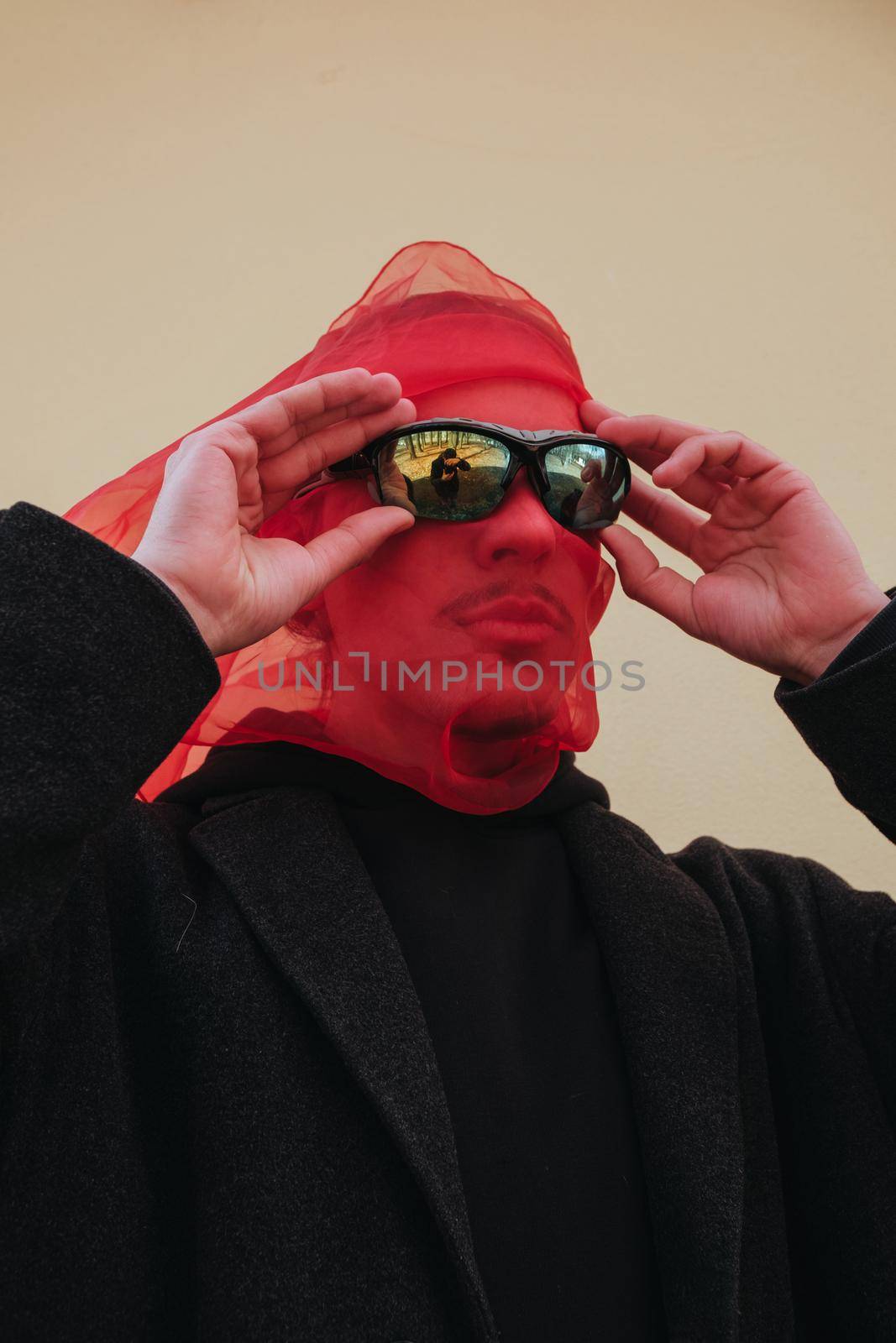 Superhero man with red mask and sunglasses fashion fighter on yellow background isolated