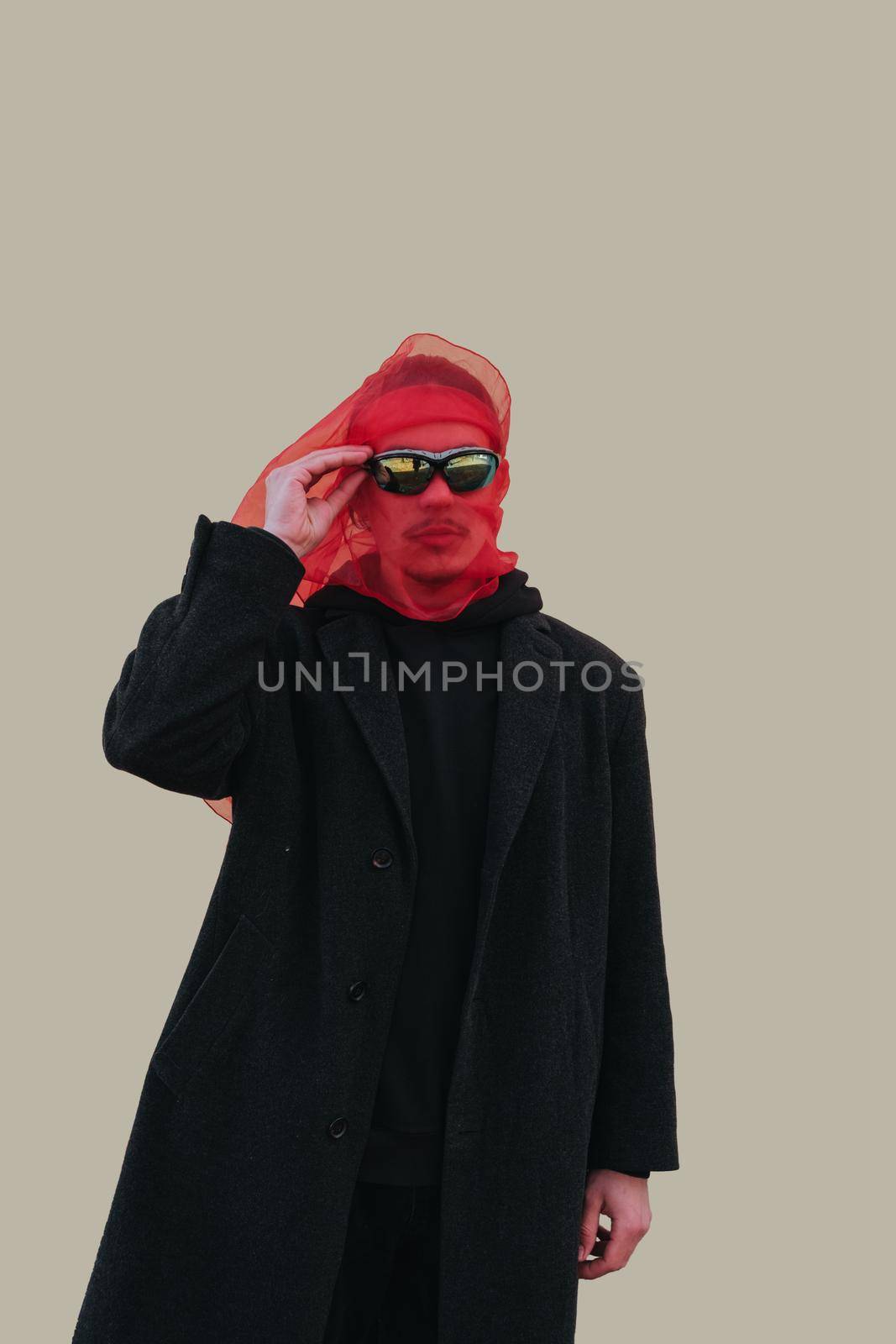 Superhero man with red mask and sunglasses fashion fighter on yellow background isolated