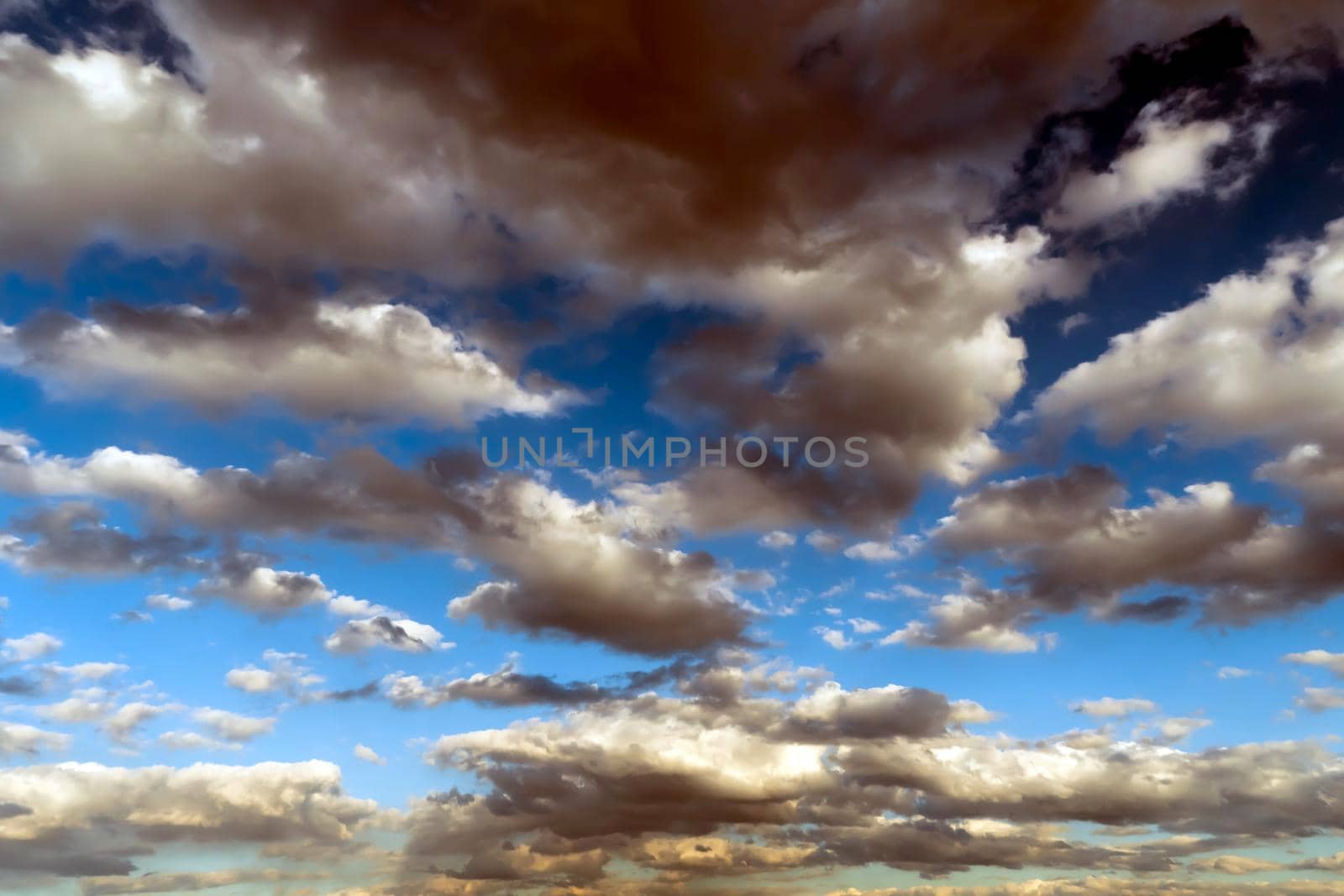 Panoramic view of the blue sky with clouds in motion. View of the blue sky with clouds in motion.Nice weather with clear skies.Heavenly Light.Dramatic sky with clouds by YevgeniySam