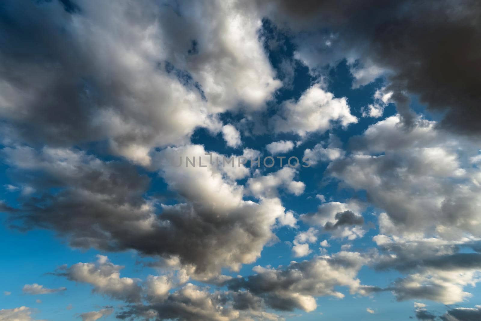 Panoramic view of the blue sky with clouds in motion. View of the blue sky with clouds in motion.Nice weather with clear skies.Heavenly Light.Dramatic sky with clouds
