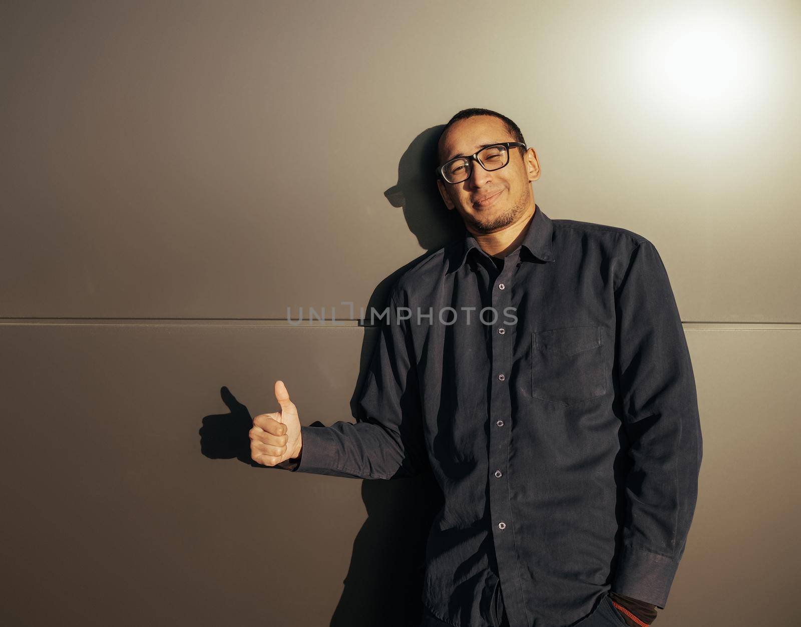 All Is Great. Cheerful Black Millennial Guy Showing Thumbs Up At Camera, Positive African American Hipster Man Gesturing Sign Of Approval, Recommending Something While Standing Over black Background