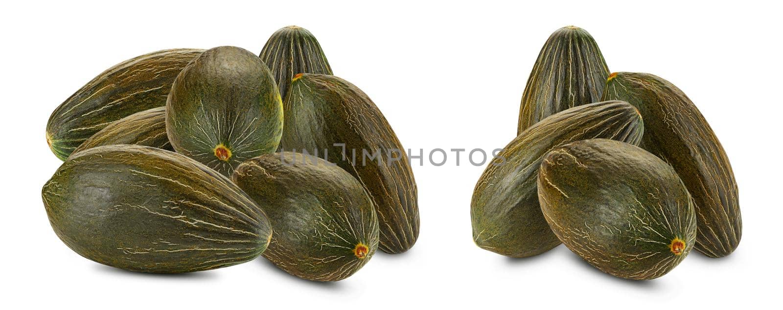 Two piles of a tasty green tendral melons isolated on white background with copy space for text or images. Pumpkin plant family. Side view. Close-up shot.