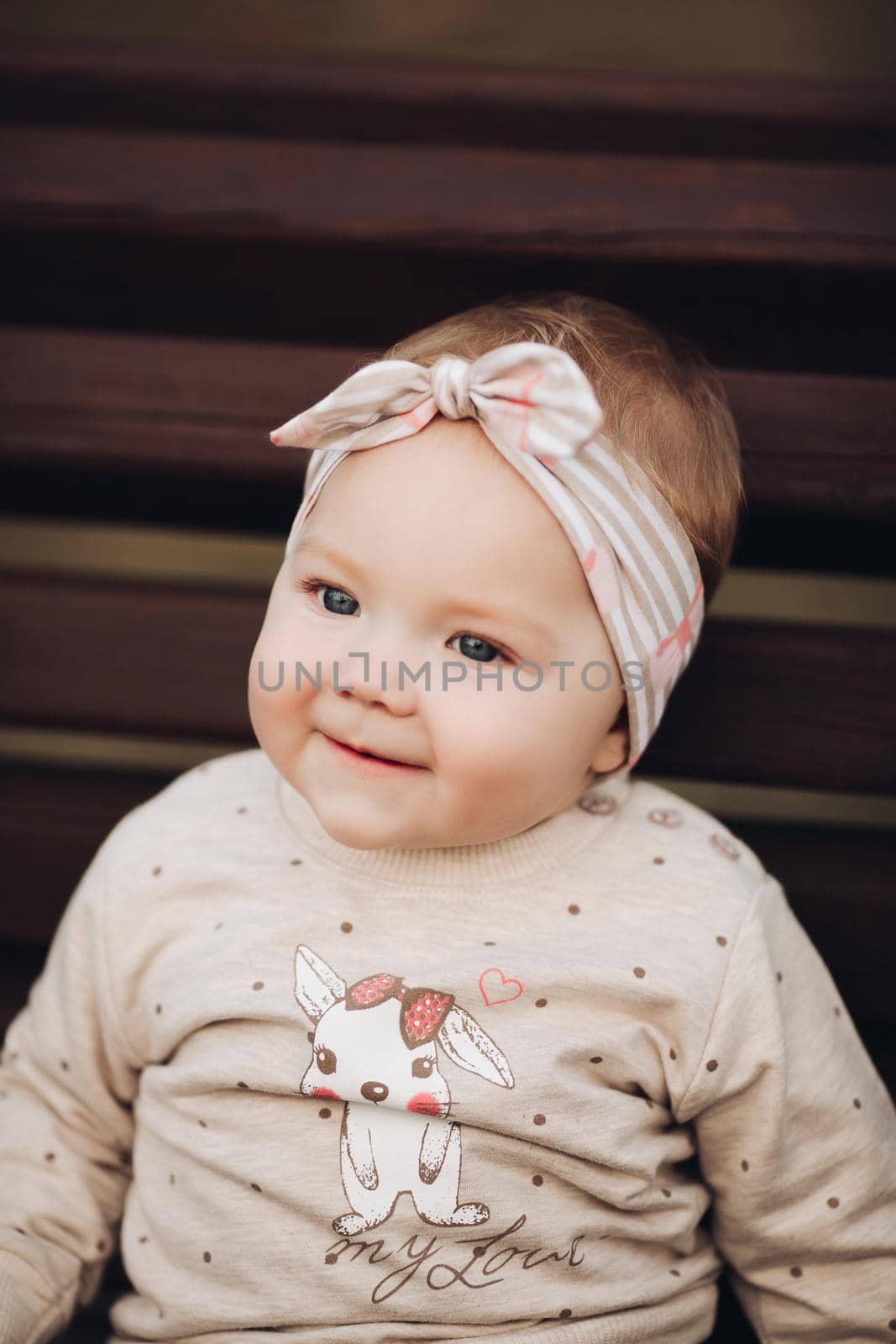 Adorable baby girl in headband, Portrait of lovely little baby girl by StudioLucky