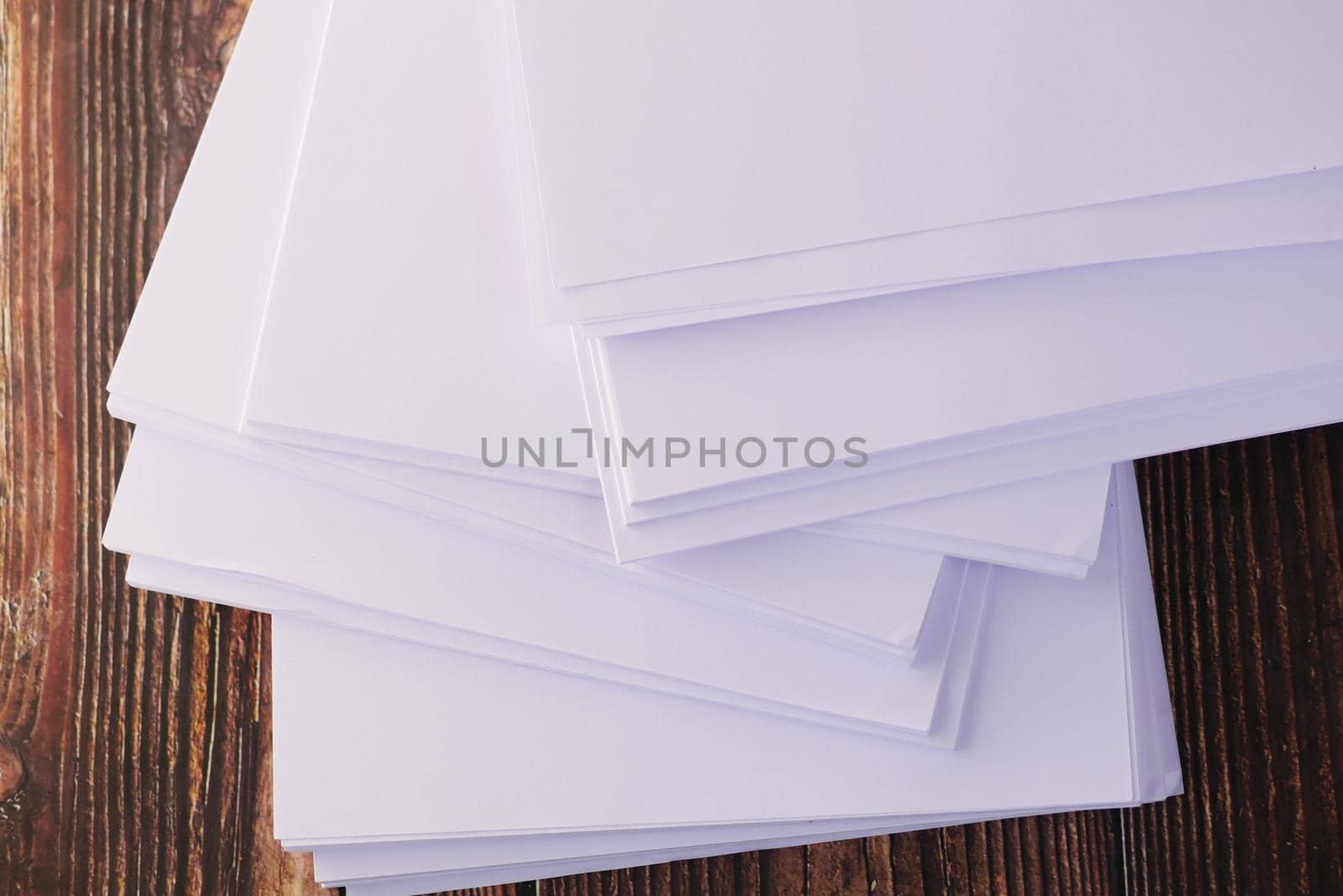 top view of stack of empty paper on table .