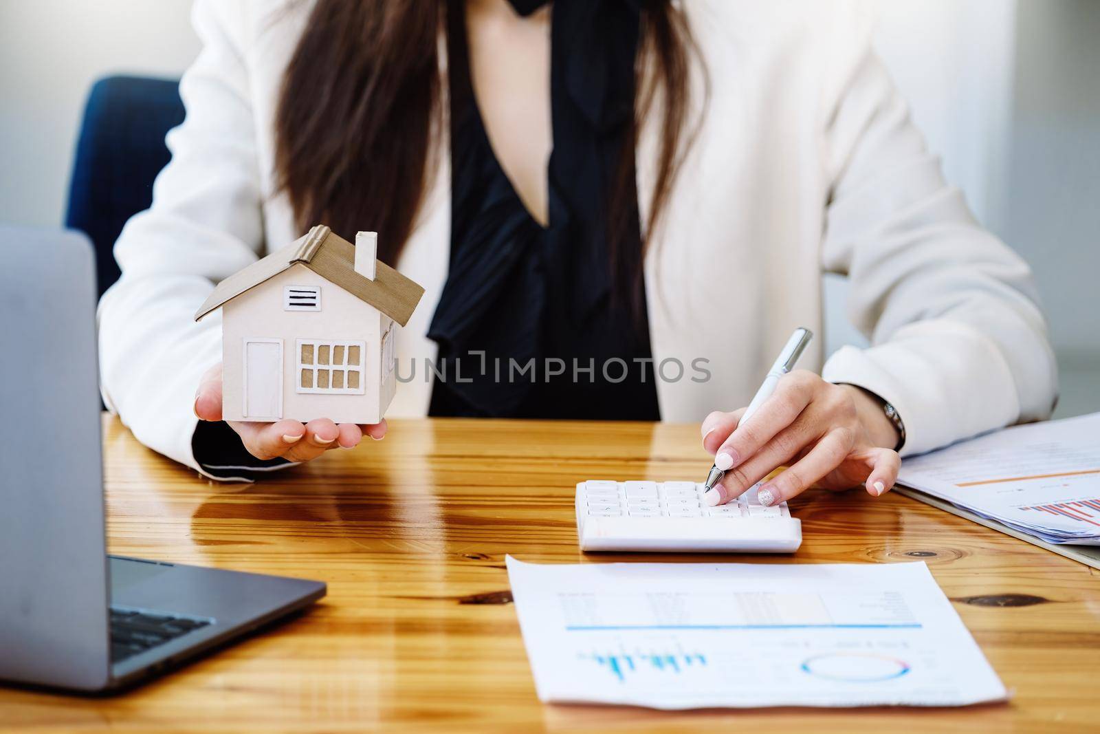 Real estate agents, land purchases and sales, property taxes, real estate owners are using calculators to calculate home and land tax expenditures to manage financial and investment risks. by Manastrong