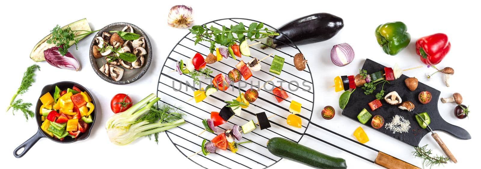 Vegetable skewer preparations on a worktop, top view